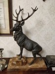 ОЛЕНЬ НА КАМЕННОМ ОСНОВАНИИ